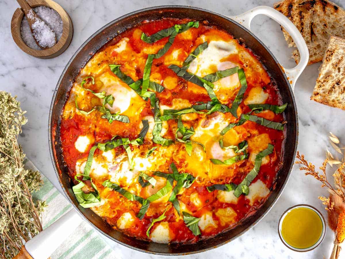 Eggs in purgatory with toasted bread and oregano on the side