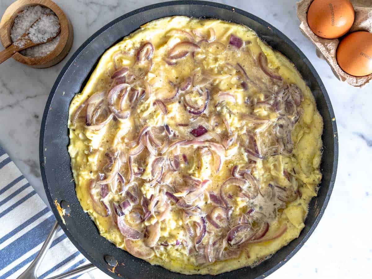 Frittata cooking on a pan