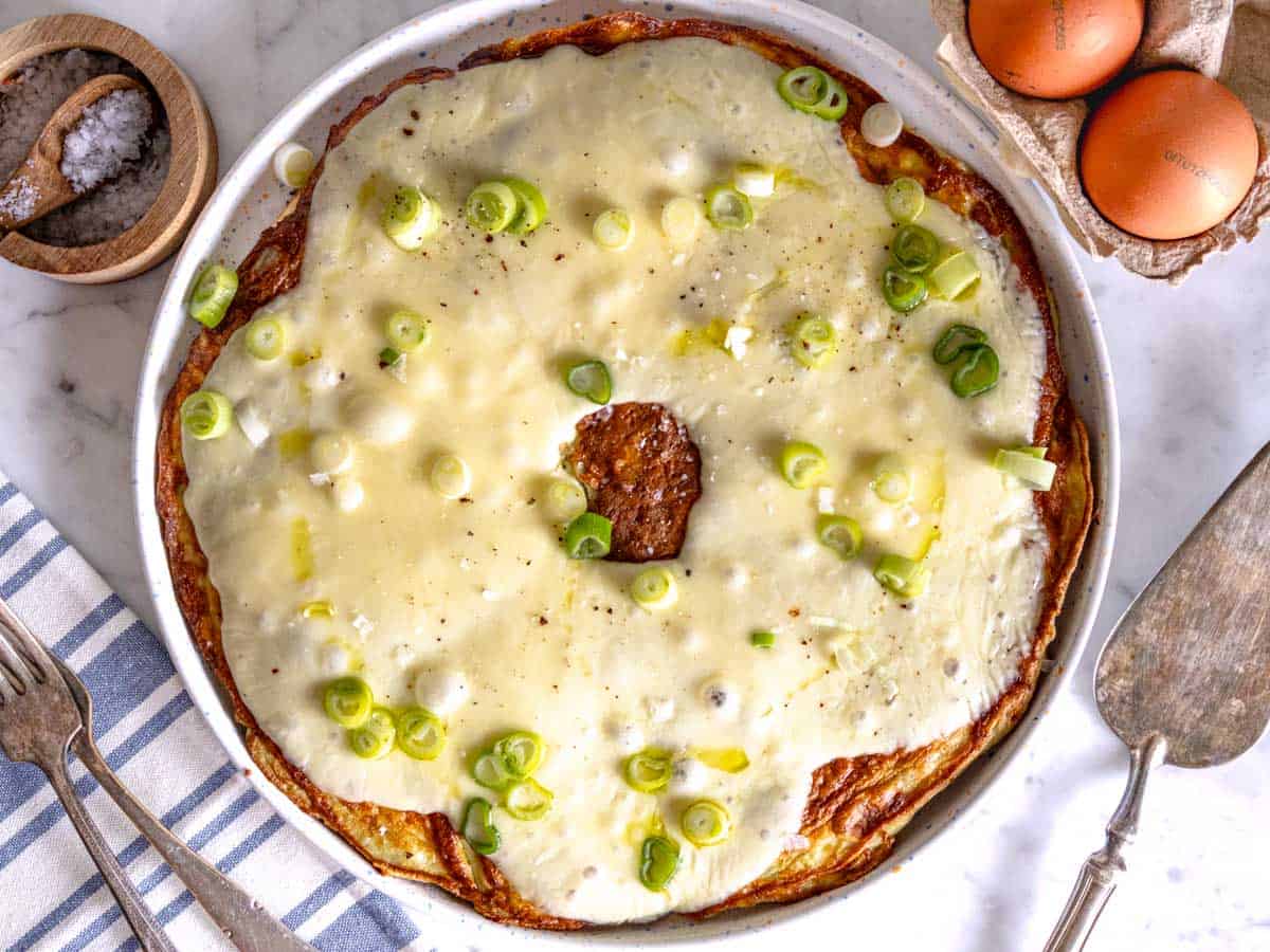 Frittata with melted cheese and spring onions