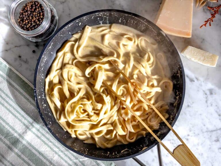 Tonnarelli on a pan with sauce