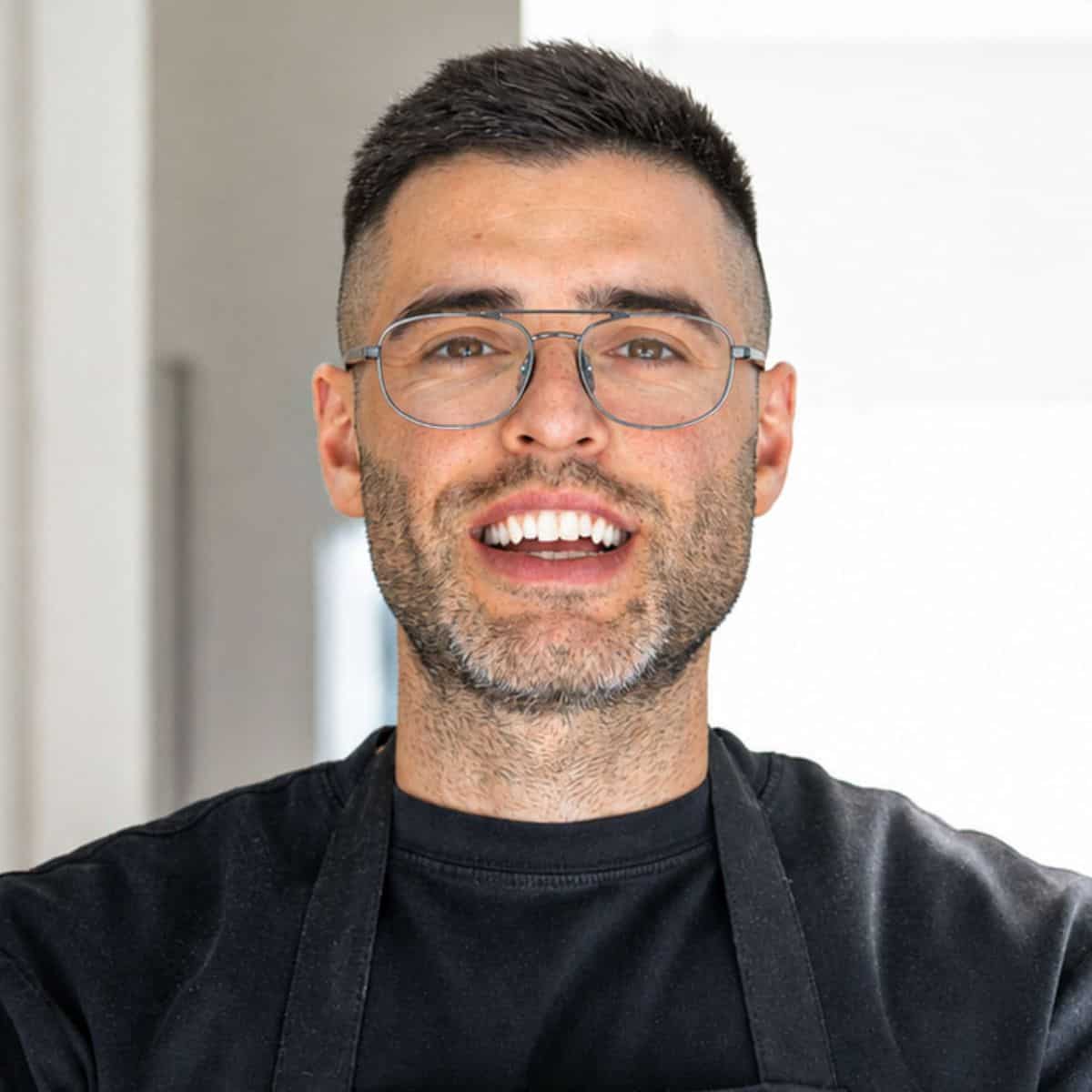 Close up of Nico smiling in his kitchen in Italy.