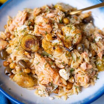 Feature image of easy sheet pan salmon orzo dinner with Mediterranean flavors.