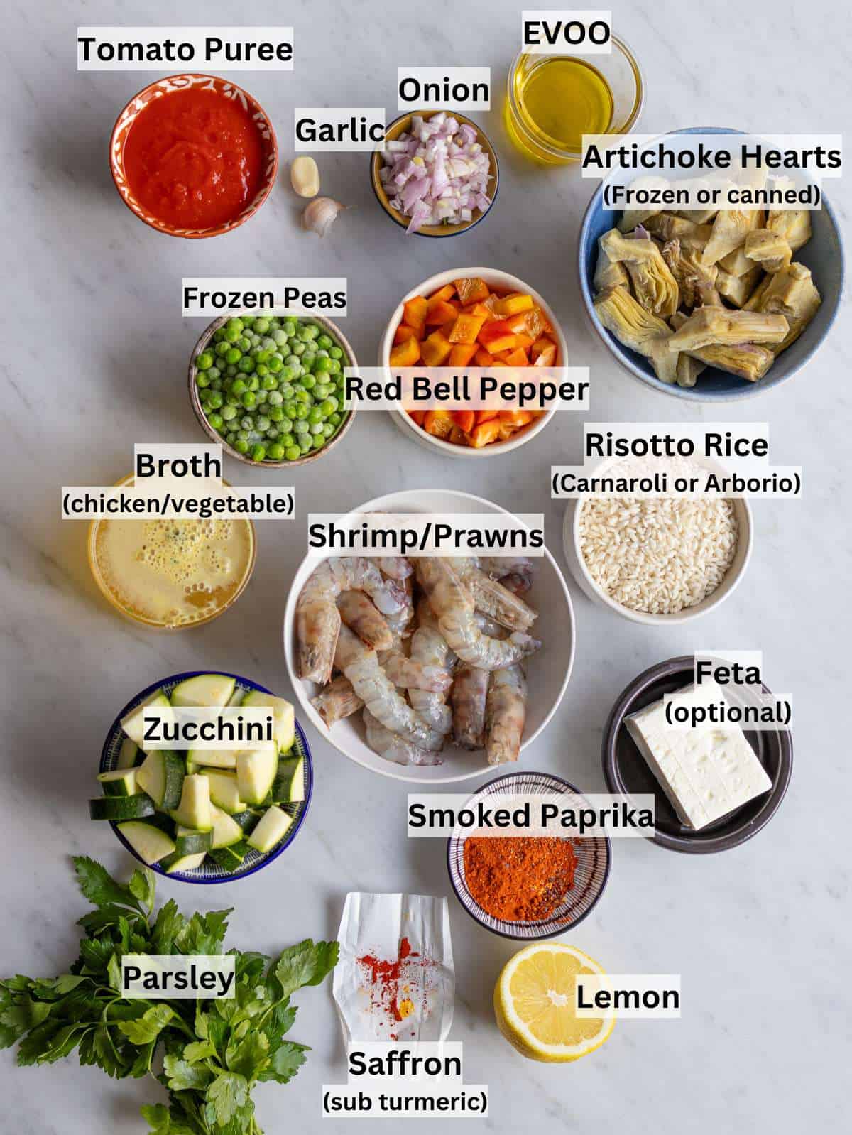 Ingredients for easy shrimp paella arranged on a kitchen counter.