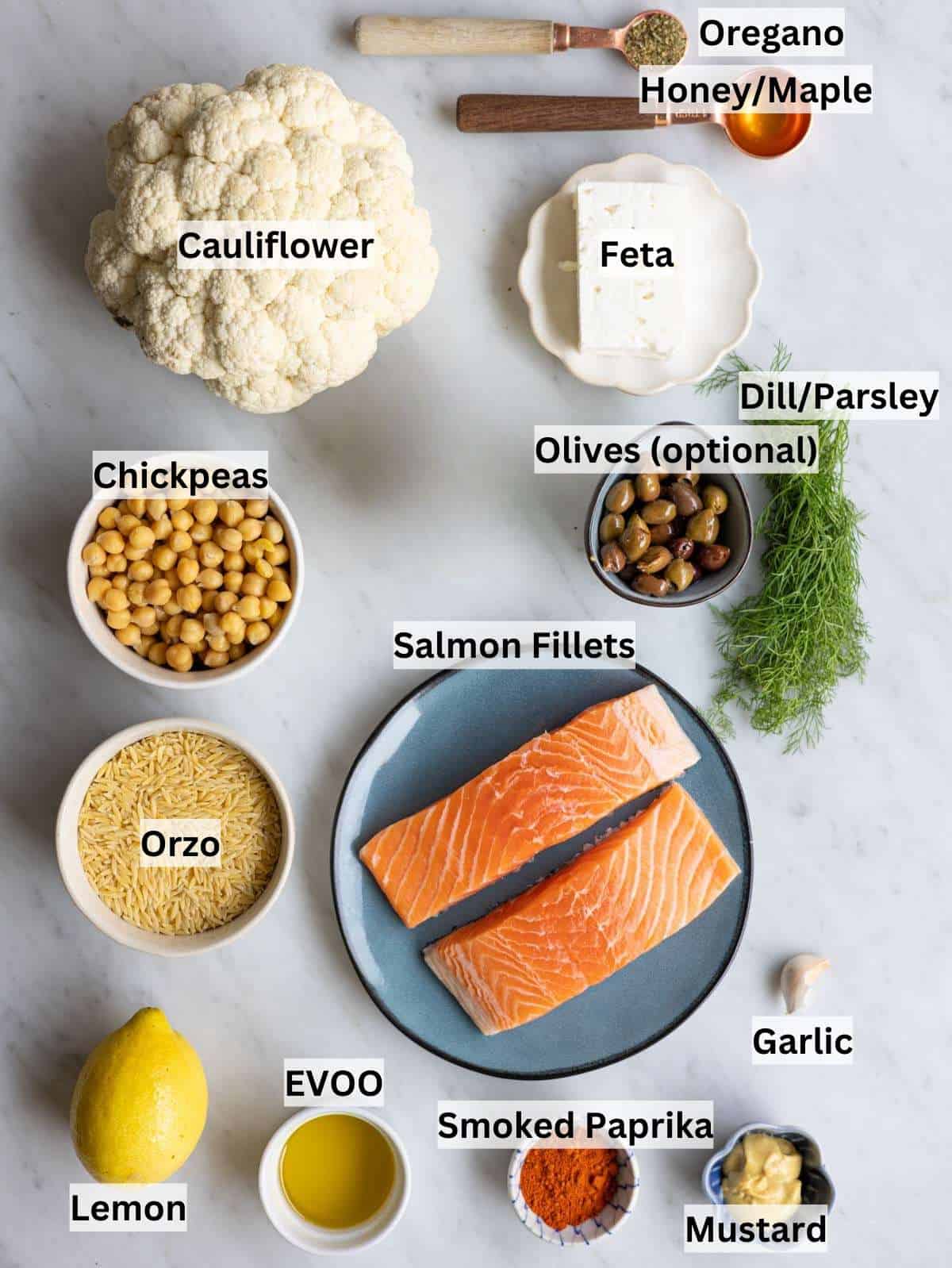 Ingredients for sheet pan salmon orzo arranged on counter ready to cook.