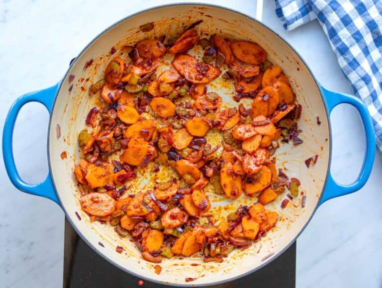 Step 1 Sautéing onions carrots and celery in olive oil to start the stew base.