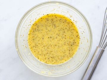 Step 3 Whisking lemon mustard dressing for Mediterranean salmon orzo