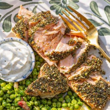 Golden roasted zaatar salmon served with yogurt and sautéed peas.