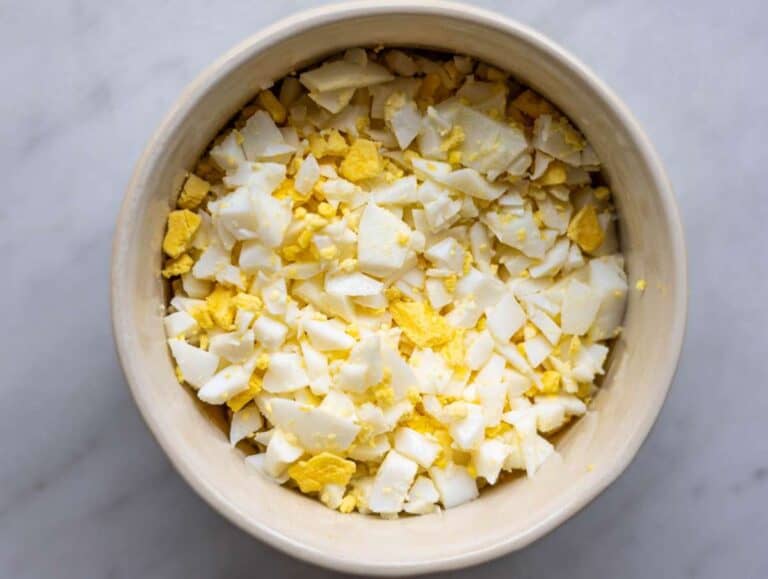 Step 1 Chopped hard boiled eggs in a small bowl.