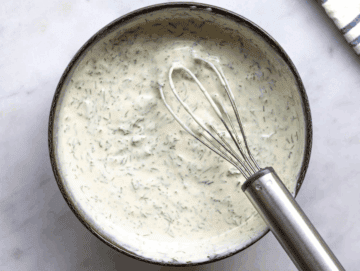 Step 1 Greek yogurt dressing whisked smooth in a bowl with dill lemon and mustard.