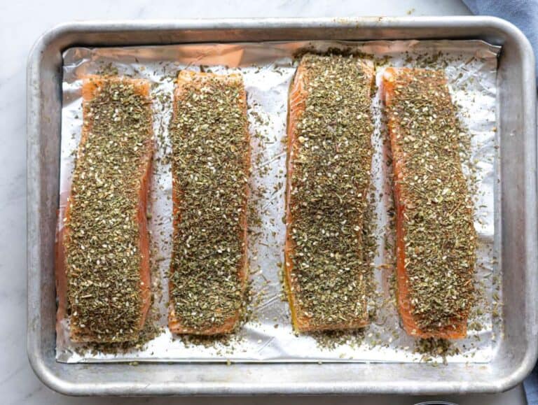 Step 2 Salmon seasoned with salt, pepper, garlic, and za’atar pressed gently into the surface.