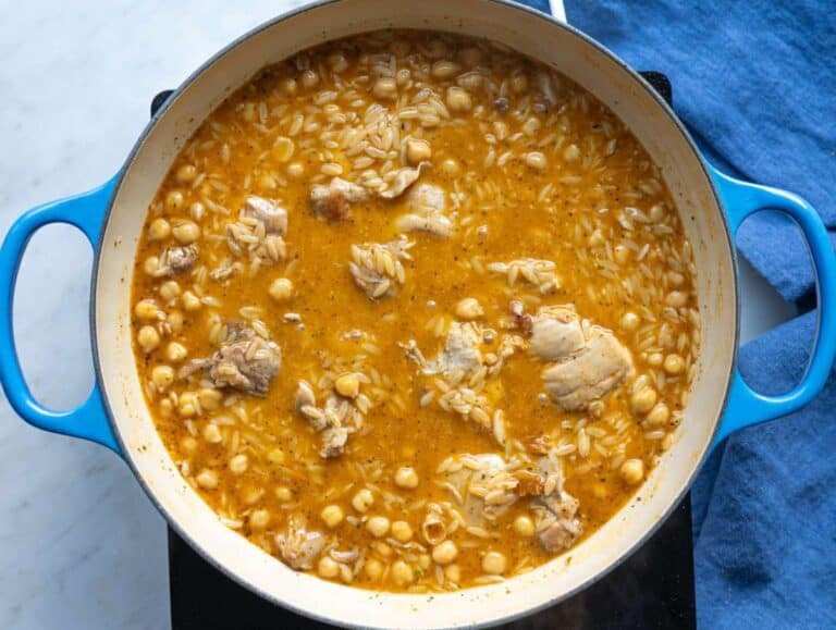 Step 3 Orzo simmering with broth chickpeas and chicken nestled back into the pan.