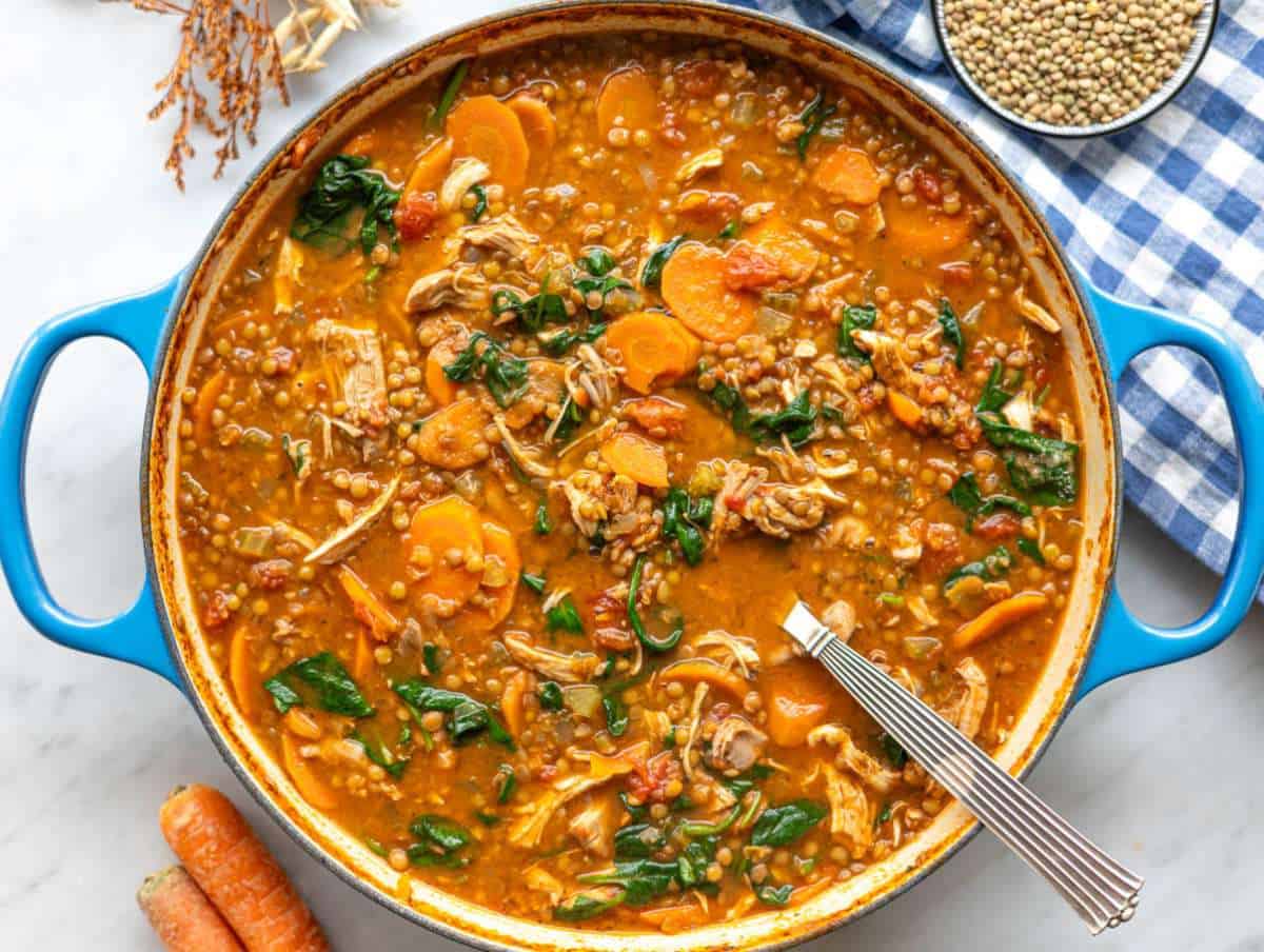 Step 4 Fresh spinach wilting into hot soup as it’s gently stirred.