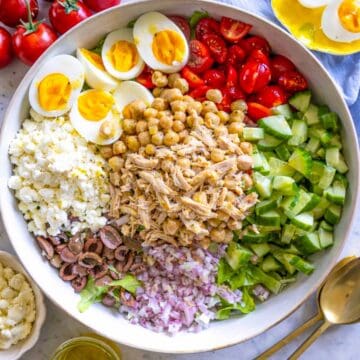 Mediterranean chopped chicken salad served in wide ceramic bowl.