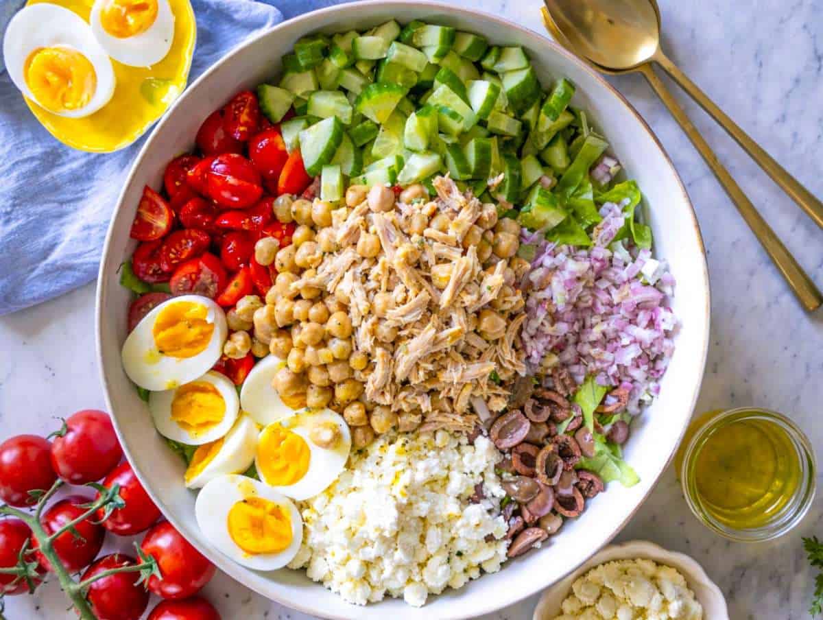 Salad before tossing in large bowl with chicken, feta, and chickpeas.