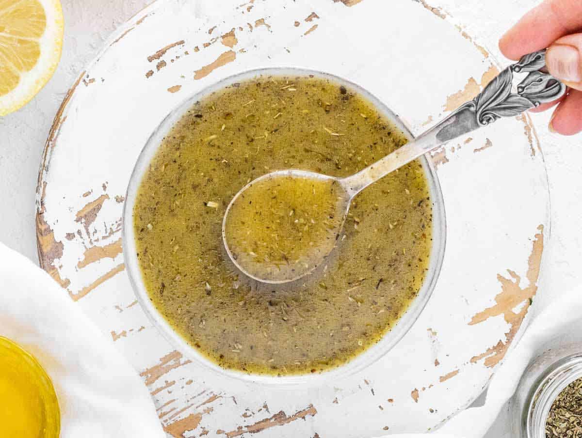 Step 1 Olive oil, lemon juice, mustard, and oregano whisked in small mixing bowl.