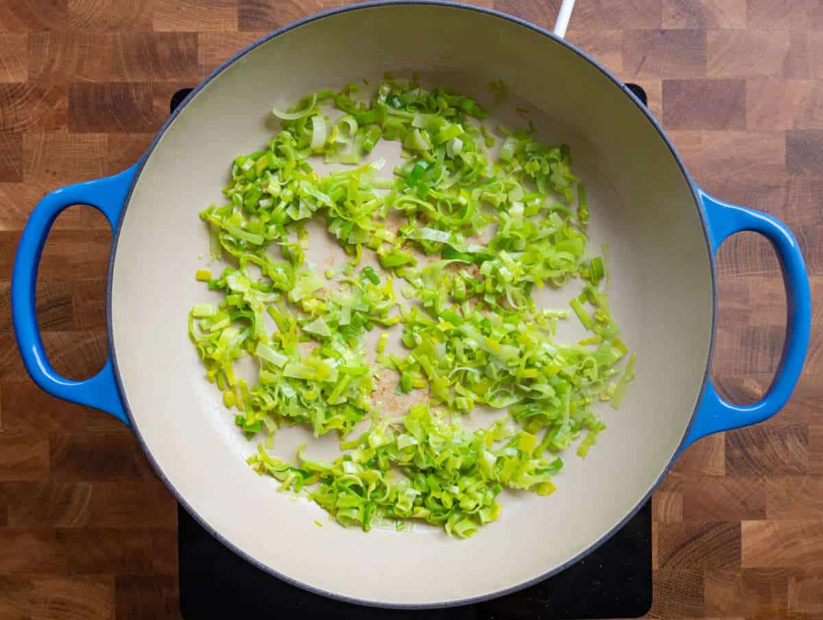 Step 1 Sliced leeks sautéing in olive oil in wide skillet.