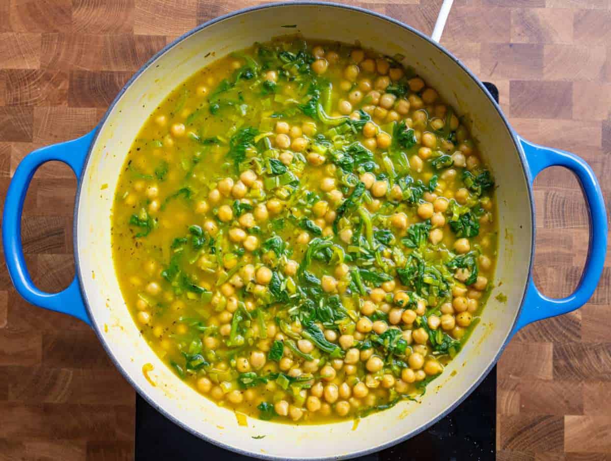 Step 3 Simmering rice absorbing broth in a skillet.