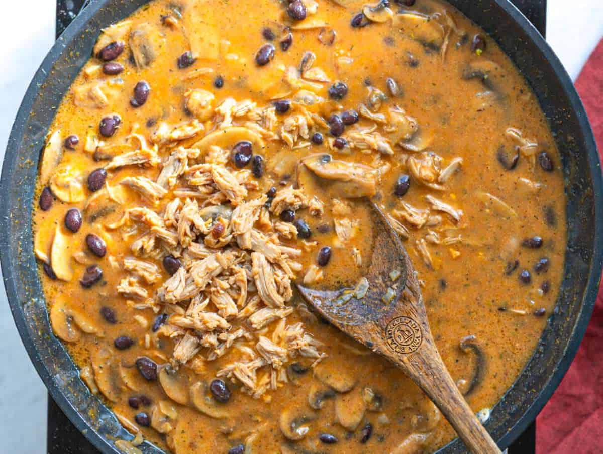 Step 4 Chicken and black beans simmering in creamy mushroom sauce.