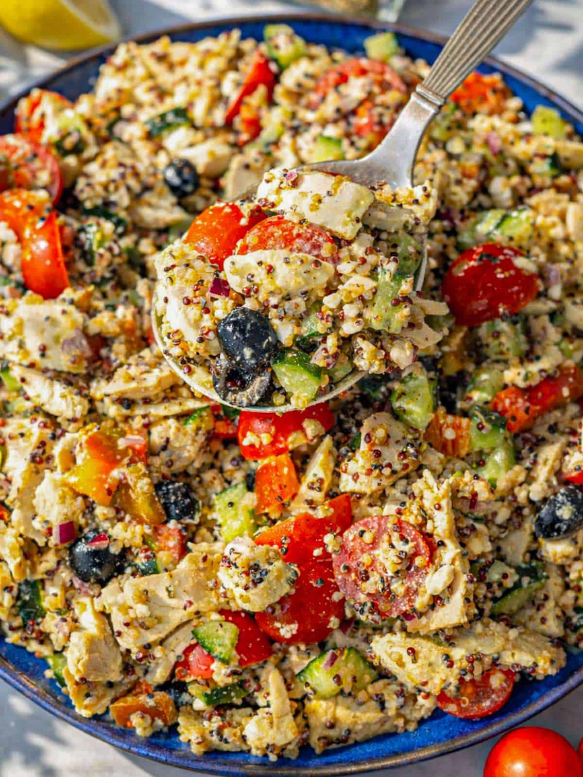 Close up of Chicken Quinoa Salad with quinoa, chicken, and lemon dressing.