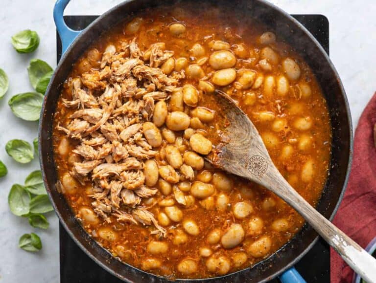 Step 2 Butter beans and shredded chicken stirred into rich tomato base in pan.