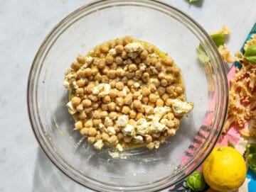 Step 2 Chickpeas and feta coated in dressing in large mixing bowl.