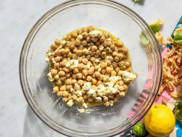 Step 2 Chickpeas and feta coated in dressing in large mixing bowl.