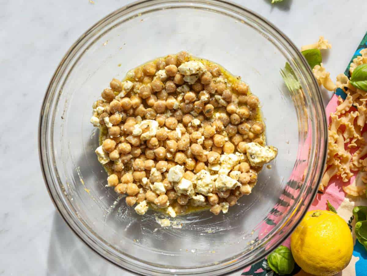 Step 2 Chickpeas and feta coated in dressing in large mixing bowl.