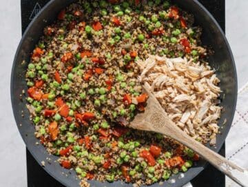 Step 2 Shredded chicken and quinoa spread flat in a pan to create golden, toasted edges.
