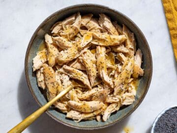 Step 2 Tossing shredded chicken with balsamic dressing in a bowl.