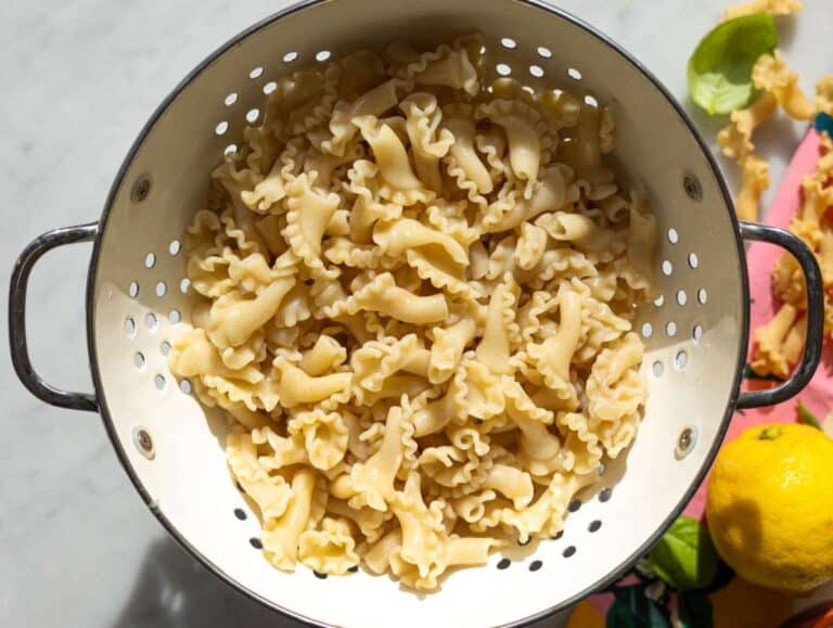 Step 3 Boiled pasta draining in a white colander.