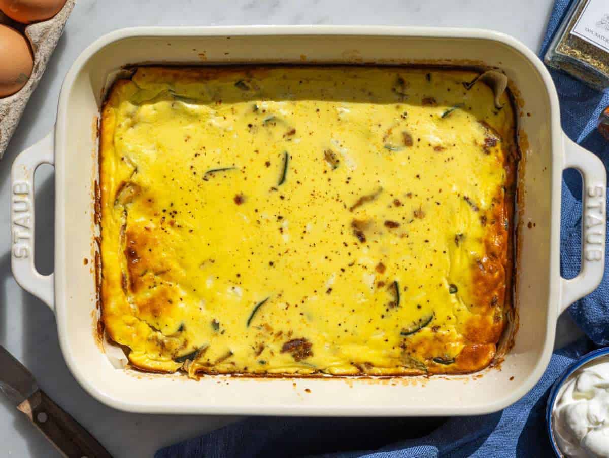 Step 3 The finished frittata resting in its baking dish on marble before being sliced into squares.