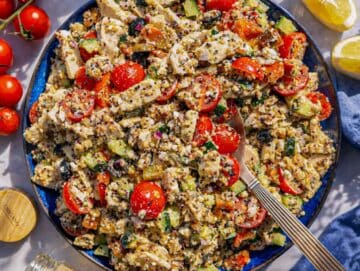 Step 3 Tossing quinoa, chicken, vegetables, and feta and serving it on a platter.