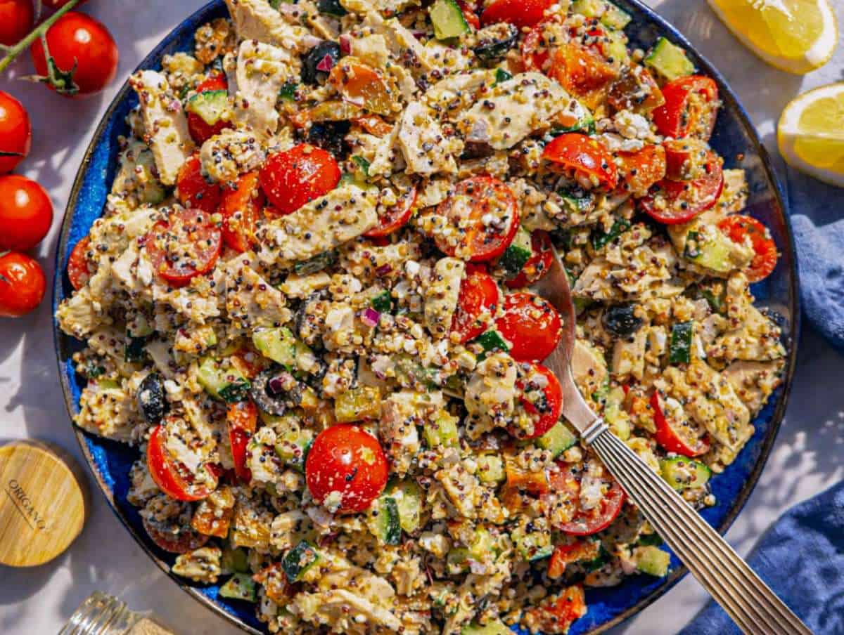 Step 3 Tossing quinoa, chicken, vegetables, and feta and serving it on a platter.