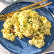Bright plate of cottage cheese eggs by window light, simple and inviting breakfast.
