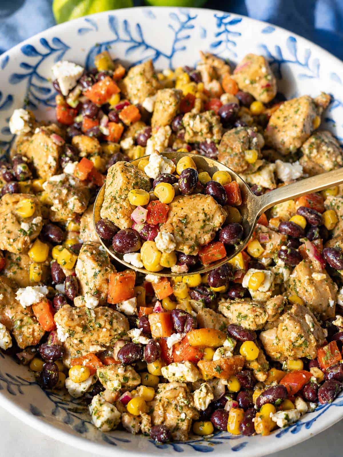Close-up chicken black bean salad with corn, black beans, and crumbled feta.