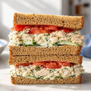 Cottage cheese chicken salad sandwich with thick creamy filling and crunchy cucumber slices.