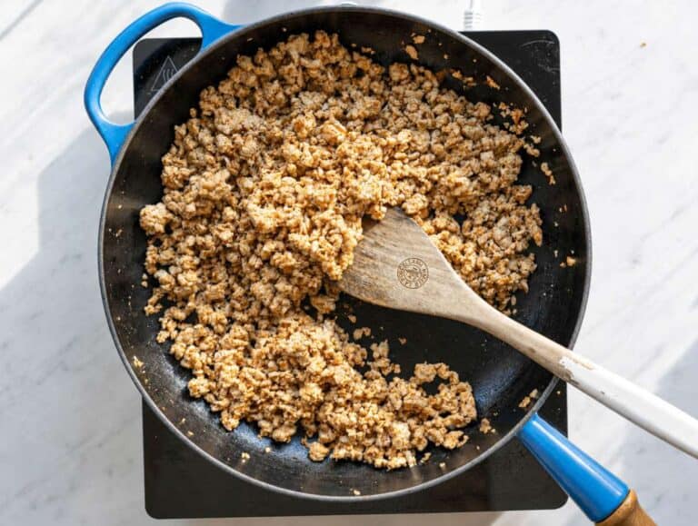 Step 1 Ground turkey browning in skillet with paprika and cumin on marble countertop.