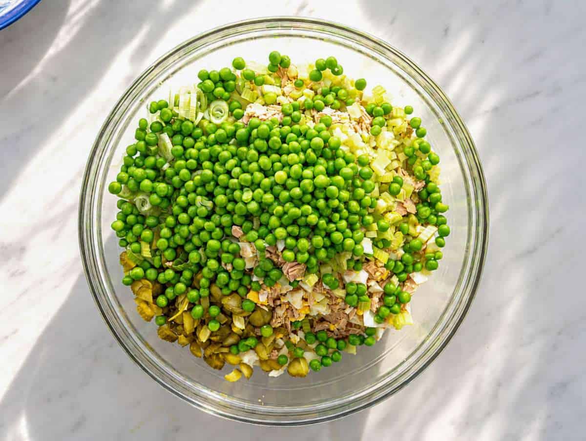 Step 3 Tuna, pasta, eggs, peas, and celery in a large bowl.