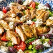 Large bowl of Greek Grilled Chicken Salad with oregano.
