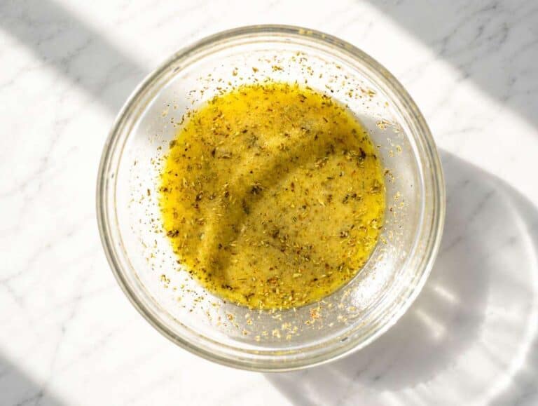 Step 1 Lemon oregano marinade whisked together in a glass bowl.