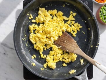 Step 1 Soft scrambled eggs cooking in a skillet until lightly set.