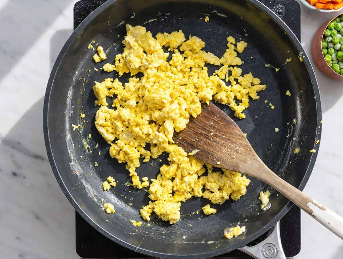 Step 1 Soft scrambled eggs cooking in a skillet until lightly set.