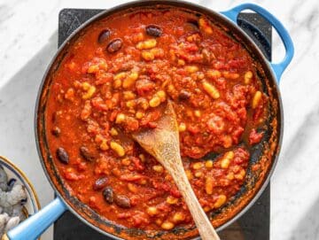 Step 2 Cannellini beans stirred into tomato sauce.