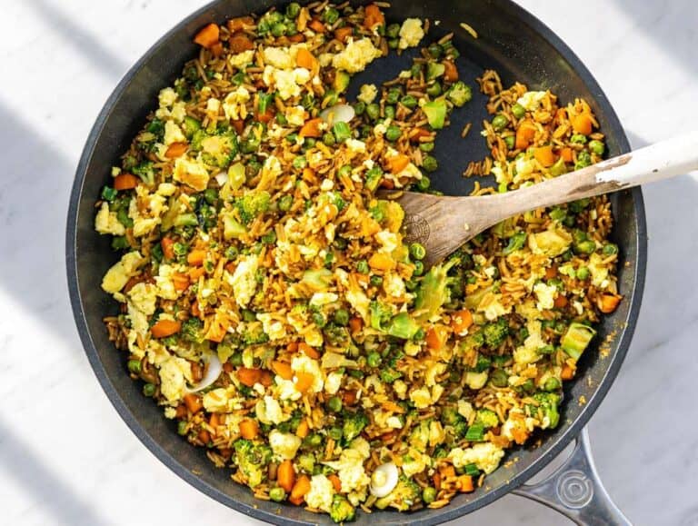 Step 3 Scrambled eggs folded into fried rice with sliced green onions.