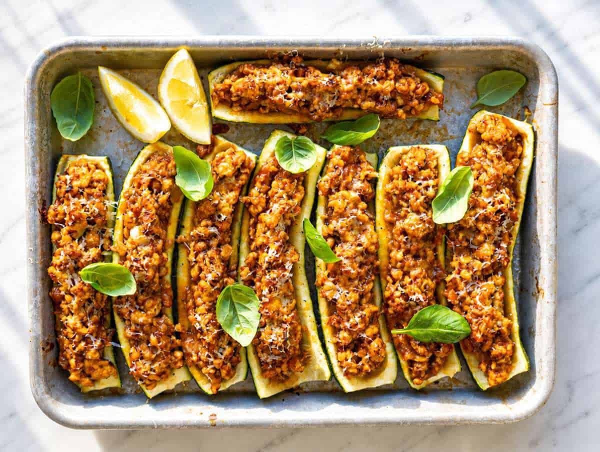 Step 4 Freshly baked turkey zucchini boats garnished with basil and lemon zest.
